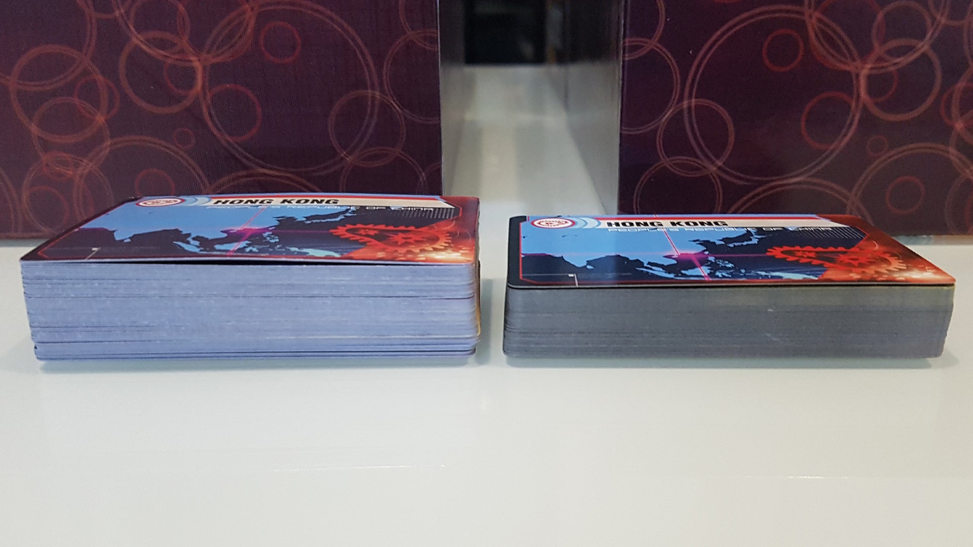 A counterfeit and real copy of board game Pandemic Legacy: Season 1 side-by-side